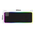 Wireless charger with colorful RGB LED glow on a FLIPSTYLEZLLC mouse pad, featuring a sleek illuminated surface.