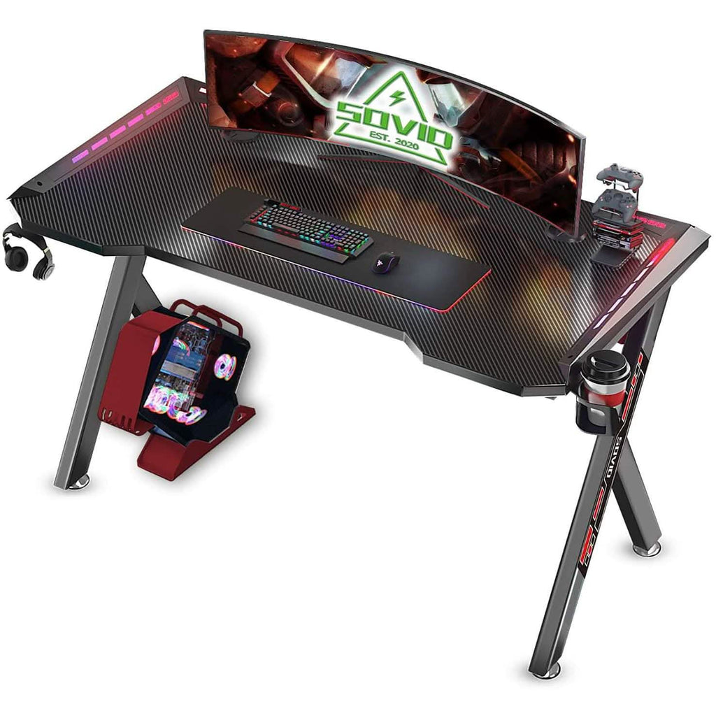Flusha gaming desk featuring LED RGB lights, ideal for video games and console setup, with spacious surface and modern design.